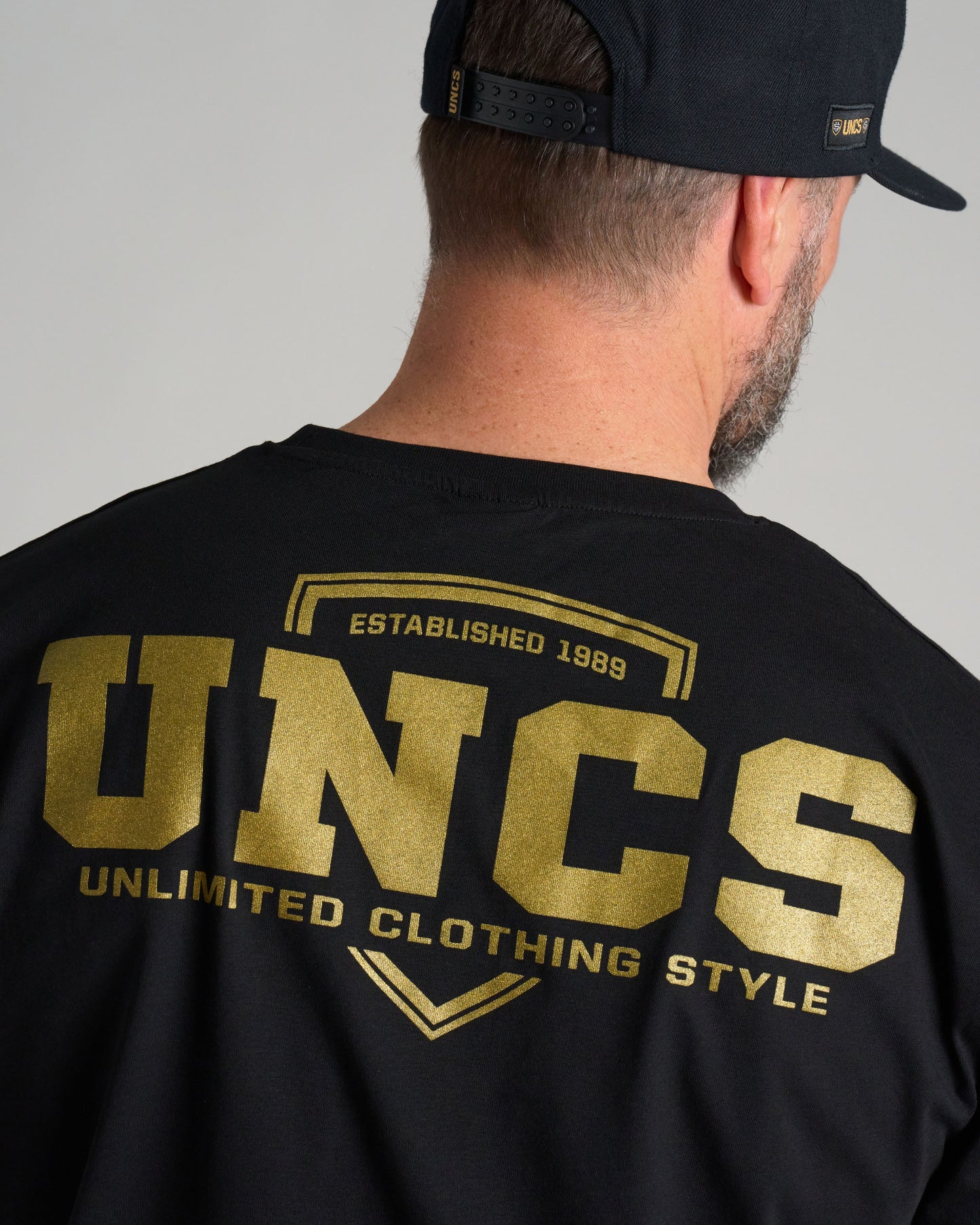 UNCS GOLD Men's T-Shirt BLACK